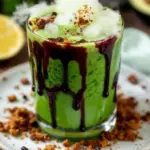 spooky witchs brew green punch with dry ice fog - featured image